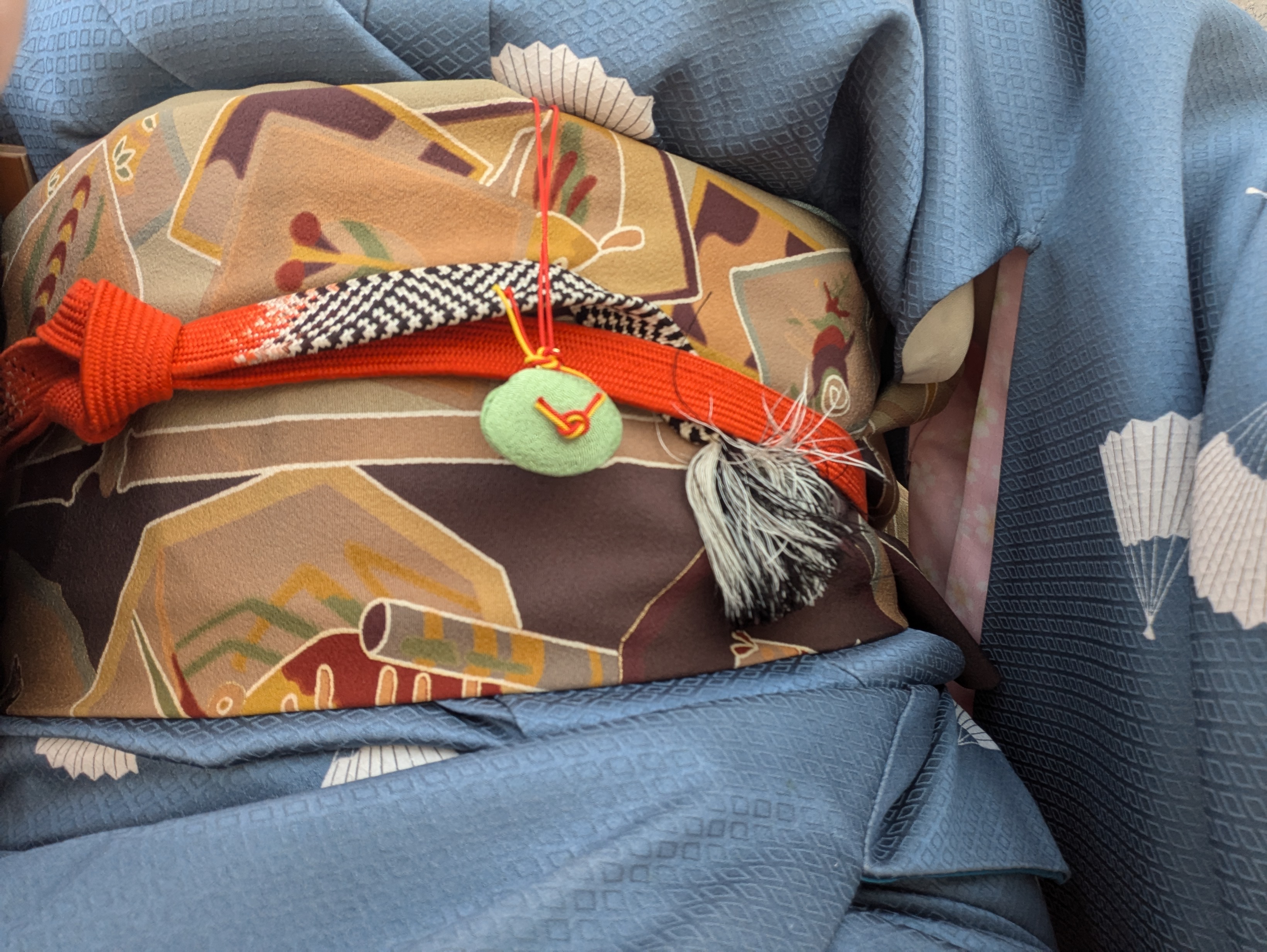 clam hanging from my obi